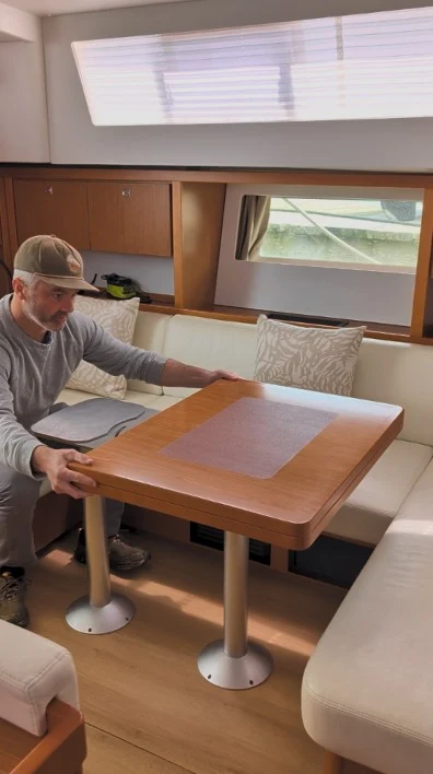 Folded tabletop sliding into position.